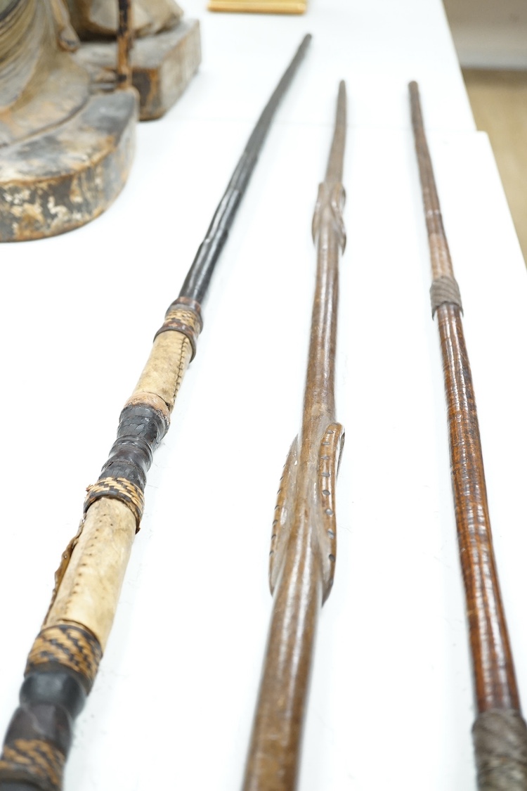 Tribal interest: Three carved hardwood African staffs, longest 148.5cm. Condition - good considering use and age